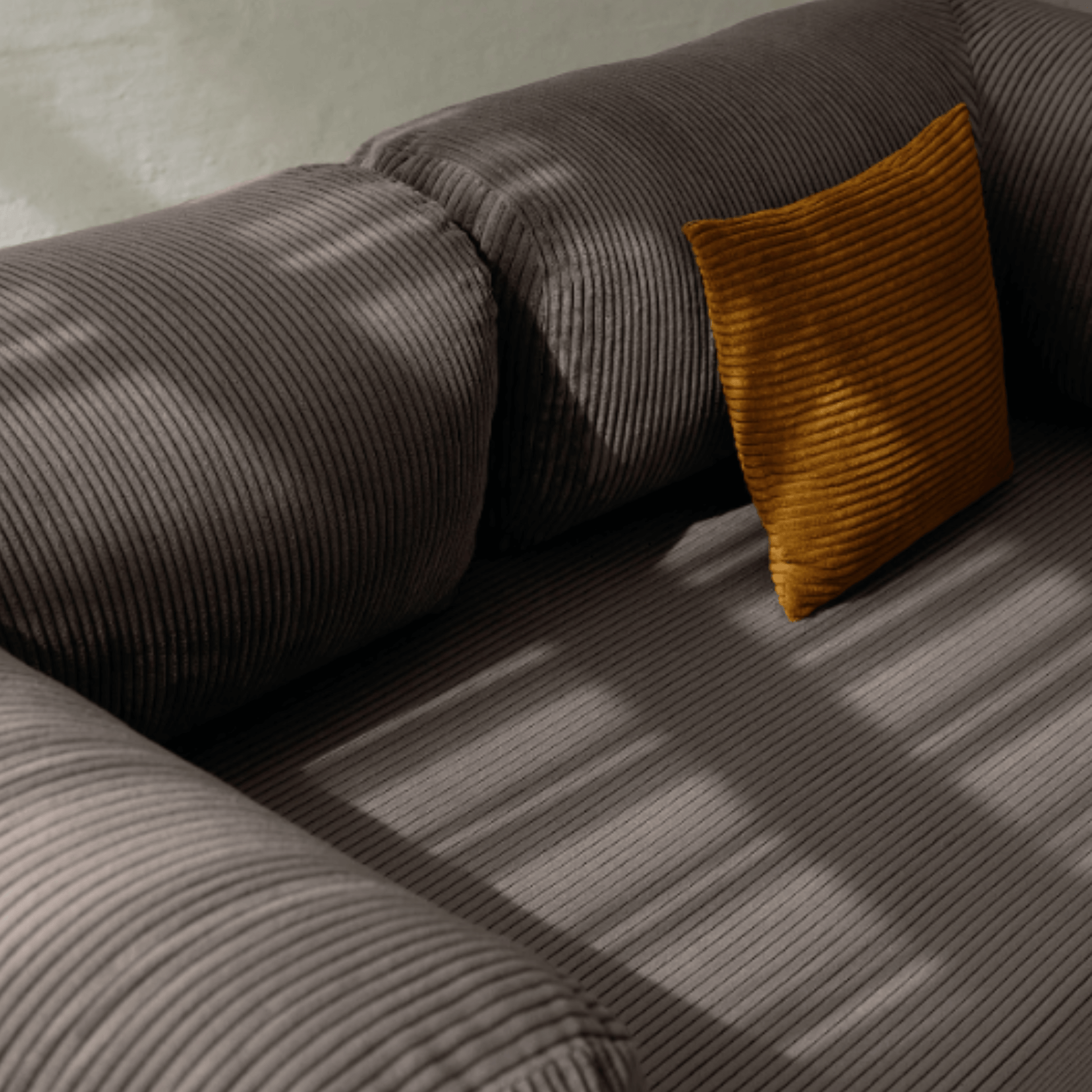 Primyhome coffee brown corduroy convertible sofa bed fabric close-up with soft natural light shadows