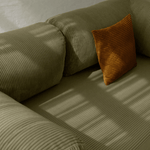 Primyhome Olive Green corduroy convertible sofa bed fabric close-up with soft natural light shadows