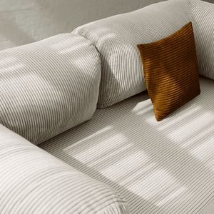 Primyhome white  corduroy convertible sofa bed fabric close-up with soft natural light shadows