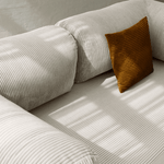 Primyhome white  corduroy convertible sofa bed fabric close-up with soft natural light shadows